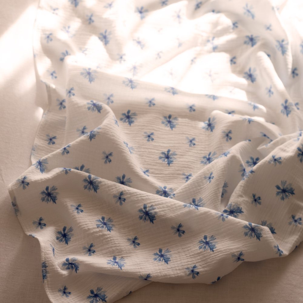 Cornflower muslin gathered in afternoon light