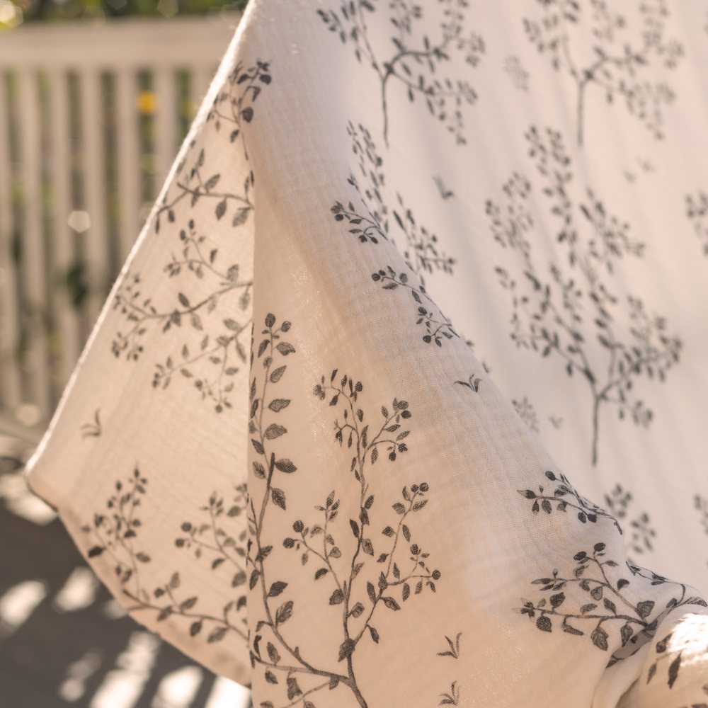 Snowberry muslin hanging on a sunlit verandah