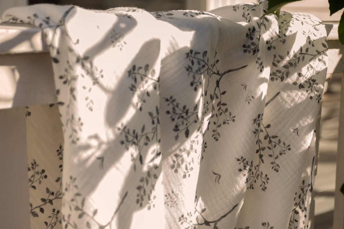 Snowberry muslin over a verandah rail beside a lemon tree